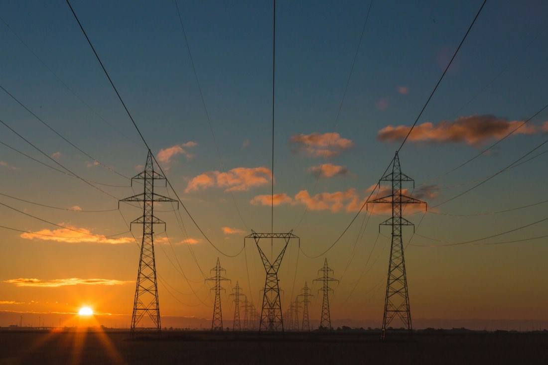Electricity pylons at sunset